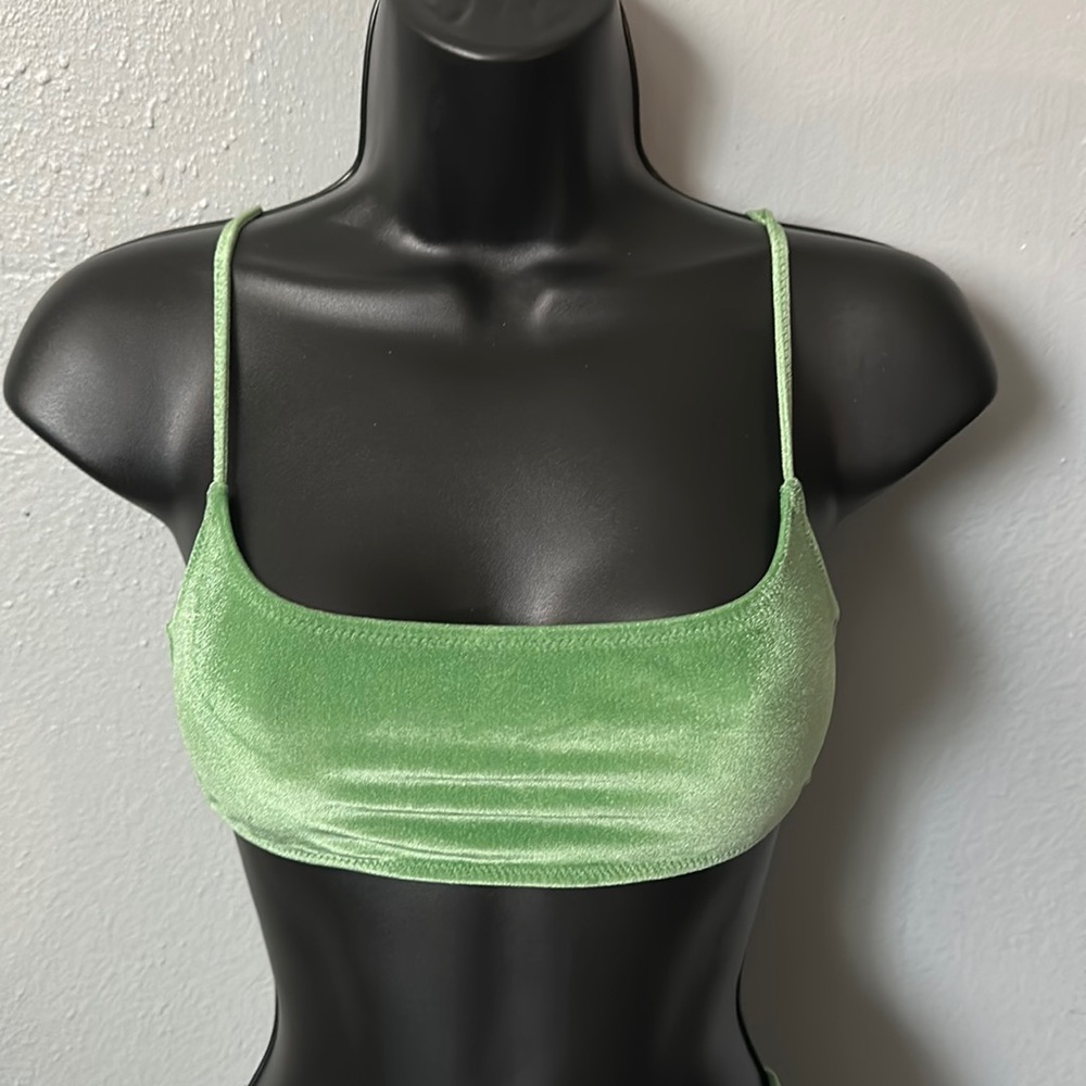Green velvet sports bra style top.